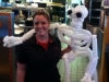 Medical Student stands with Life Size Skeleton